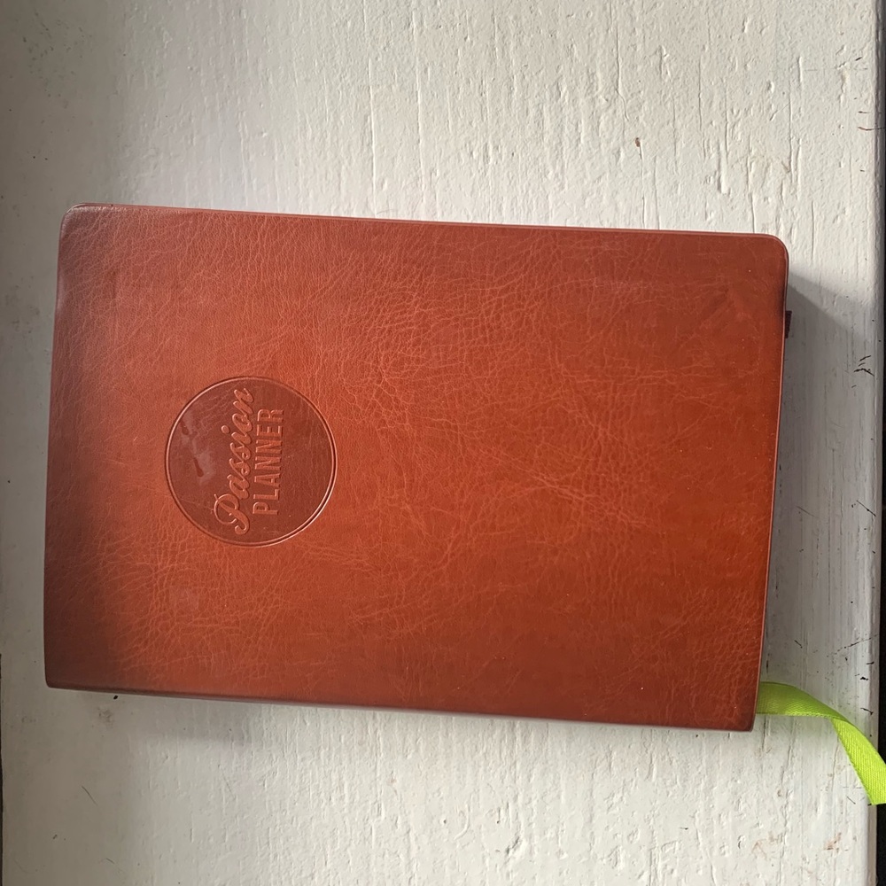 Brown small compact passion planner.